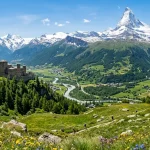 Una vista estiva della Valle d'Aosta con un castello e il Cervino in lontananza