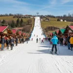 Natale senza neve con pista innevata artificialmente dentro mercatino natalizio
